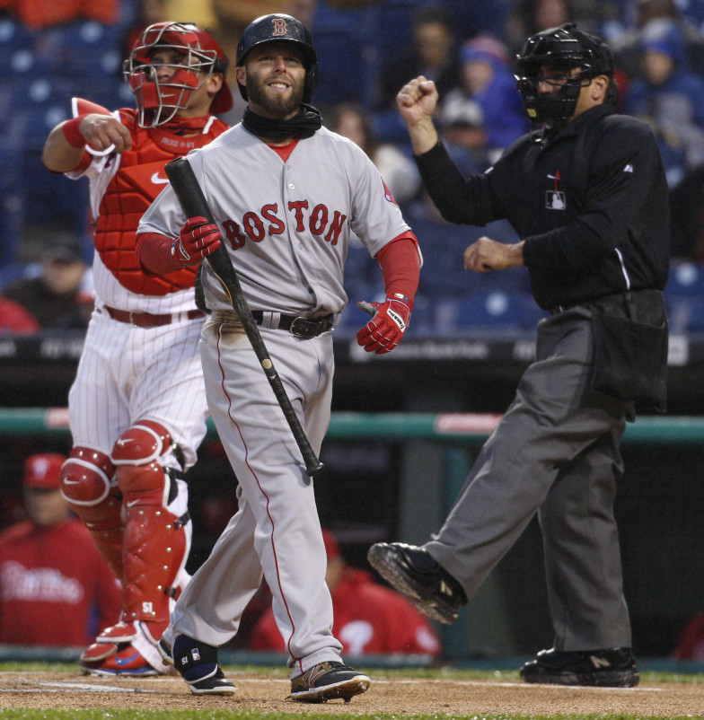 Boston’s Dustin Pedroia reacts to being called out on strikes by umpire Phil Cuzzi in the first inning Wednesday night in Philadelphia. The Red Sox managed just three hits in a 4-2 loss to the Phillies.