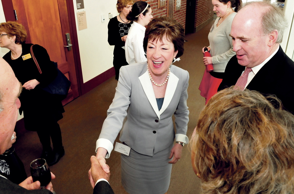 U.S. Sen. Susan Collins greets well-wishers after arriving for a dinner and speaking engagement at Colby College in Waterville on Thursday.