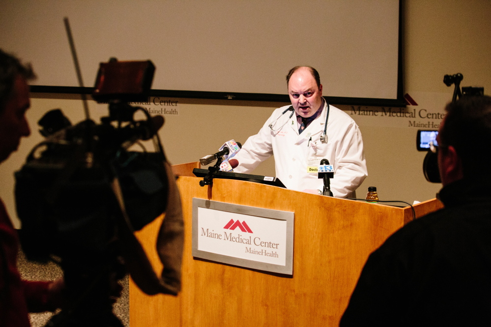 Maine Medical Center Transplant Program Director Dr. John Vella addresses members of the media to discuss whether funds raised through online crowd sourcing will prevent Josh Dall-Leighton from being eligible to donate a kidney to Christine Royles at the hospital’s Dana Center Auditorium in Portland on Thursday.