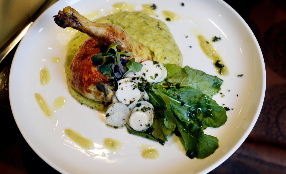 The Cornish hen entrée at Eve’s at the Garden is stuffed with a combination of ground chicken and duck and served with polenta.