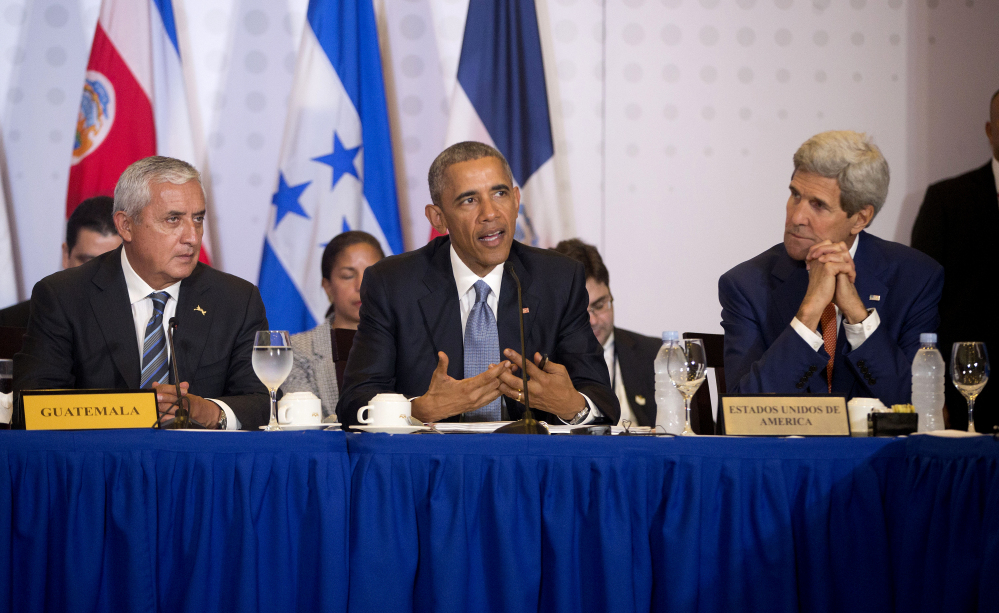 President Obama, Secretary of State John Kerry and Guatemalan President Otto Perez Molina speak during a meeting with Central American Integration System presidents, Friday in Panama City. Obama is in Panama to attend the VII Summit of the Americas.
The Associated Press