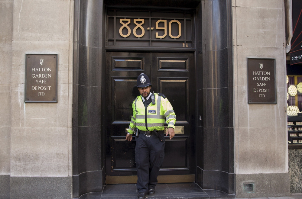 A police officer leaves the Hatton Garden Safe Deposit company following the audacious theft of jewelry in early April.