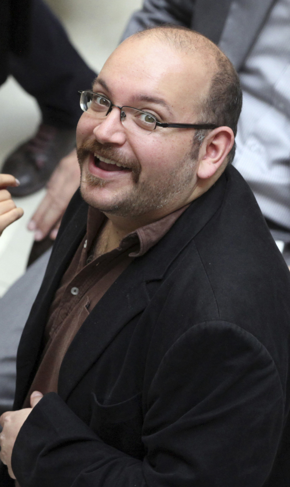 Jason Rezaian, an Iranian-American journalist for the Washington Post, attends an Iranian presidential campaign event in 2013.