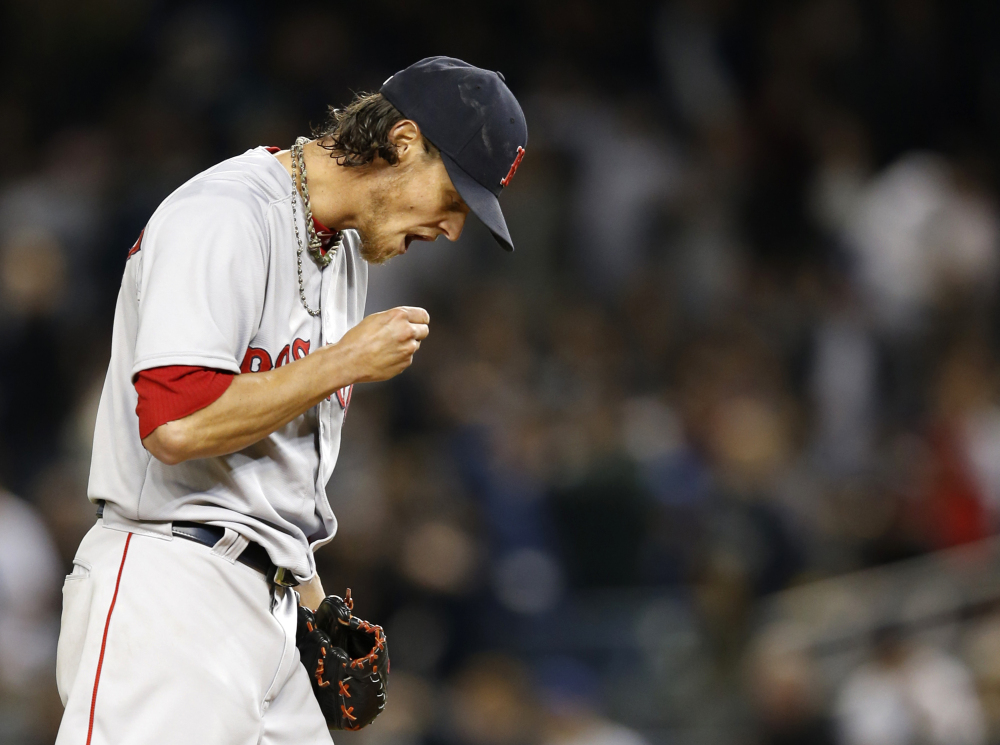Boston Red Sox starting pitcher Clay Buchholz reacts during the first inning against the New York Yankees in New York on Sunday. The Yankees scored seven runs in the inning and went on to win 14-4. The Associated Press