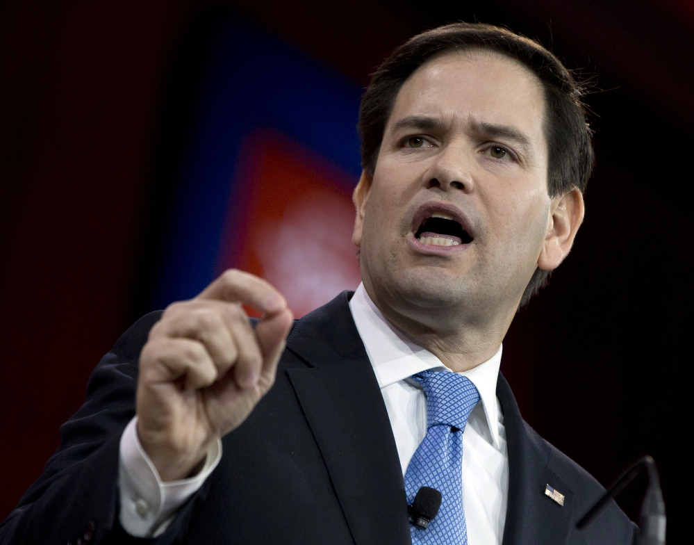 In this Feb. 27, 2015 file photo, Sen. Marco Rubio, R-Fla. speaks in National Harbor, Md. When Rubio launches his Republican presidential campaign Monday, he’ll have to answer a simple question.