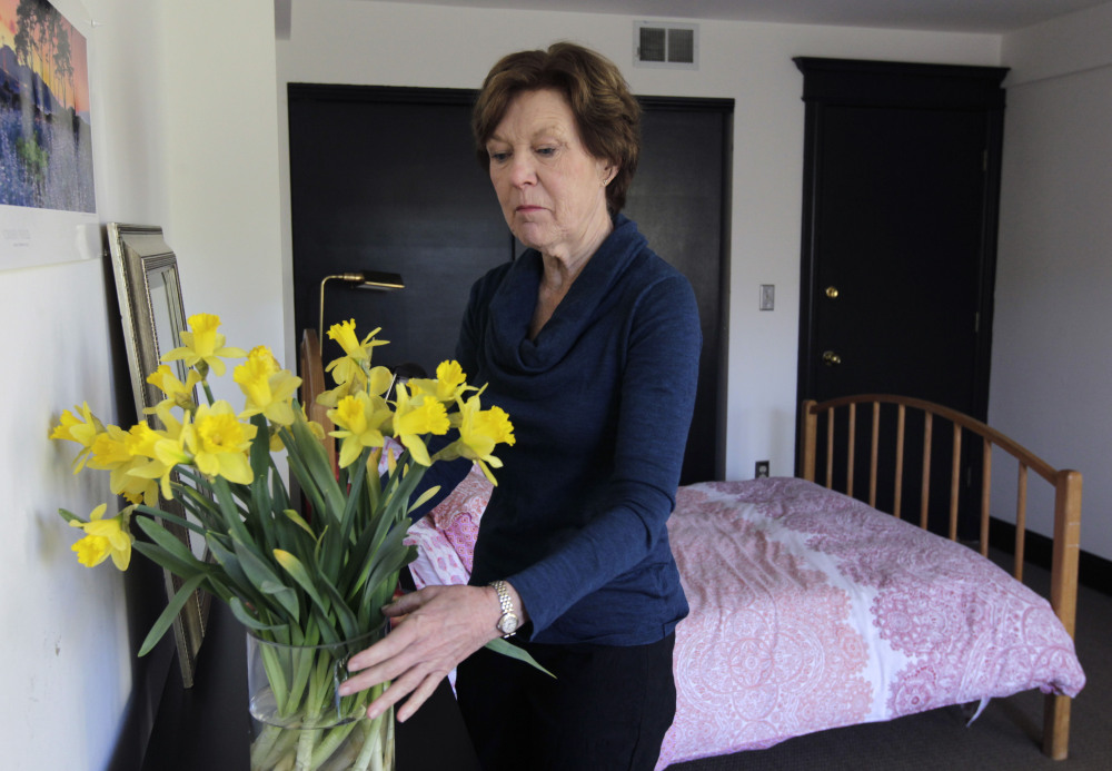 Airbnb host Lorraine Rorke Bader arranges fresh flowers at her San Francisco home before the arrival of an overnight guest. In looking at small-scale, short-term rentals, legislators in Maine should tread lightly before placing restrictions on what’s still a very new market.