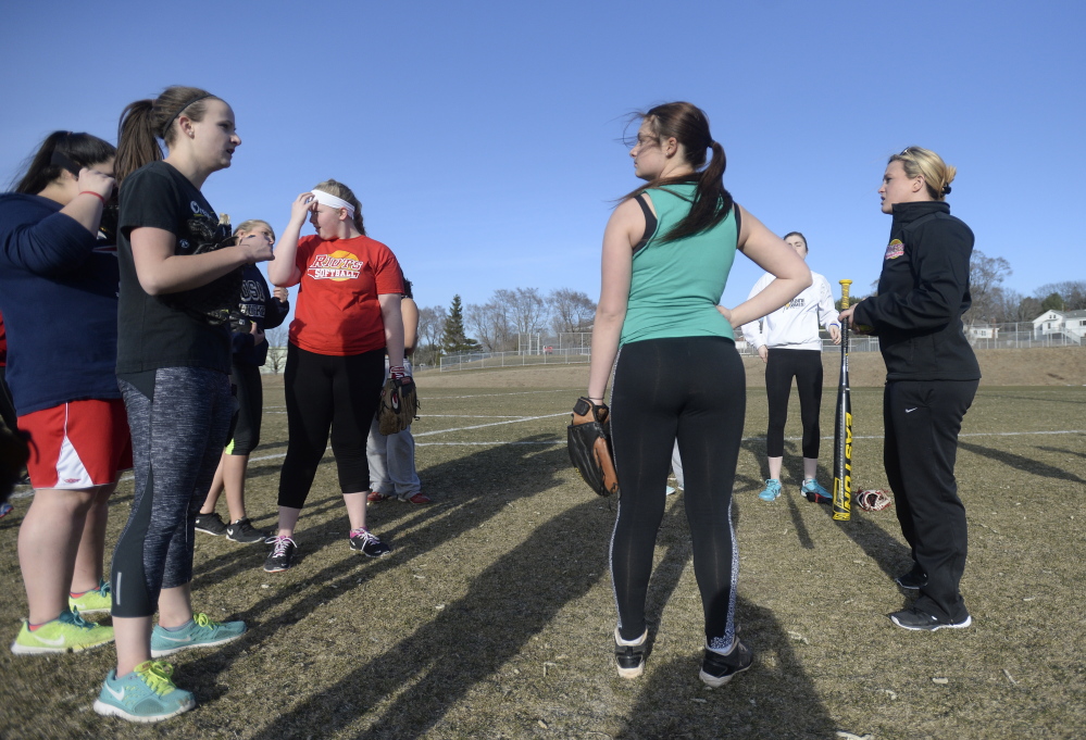 First-year South Portland High softball coach Alexis Garrison, right, talks with her players during practice Monday.
Shawn Patrick Ouellette/Staff Photographer