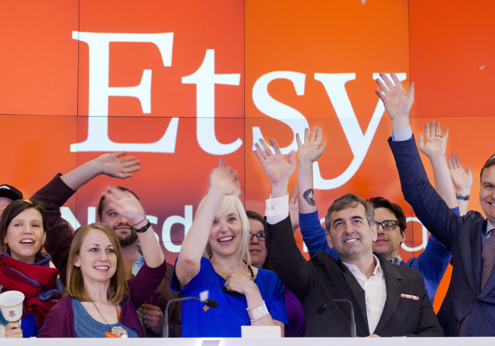 Kristina Salen, center left, Etsy’s chief financial officer, stands with Chad Dickerson, center right, chairman and CEO, to celebrate the company’s IPO Thursday.