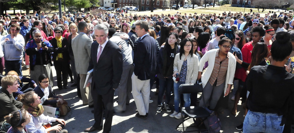 Colby College President David Greene, center, makes his way through more than 500 students and staff to speak during a racial forum on campus in Waterville on Thursday.