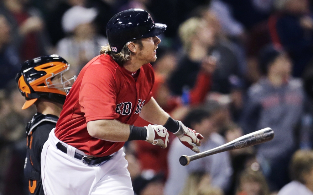 Red Sox catcher Ryan Hanigan tosses his bat as he watches the flight of his two-run home run off Baltimore Orioles pitcher Kevin Gausman in the fifth inning.