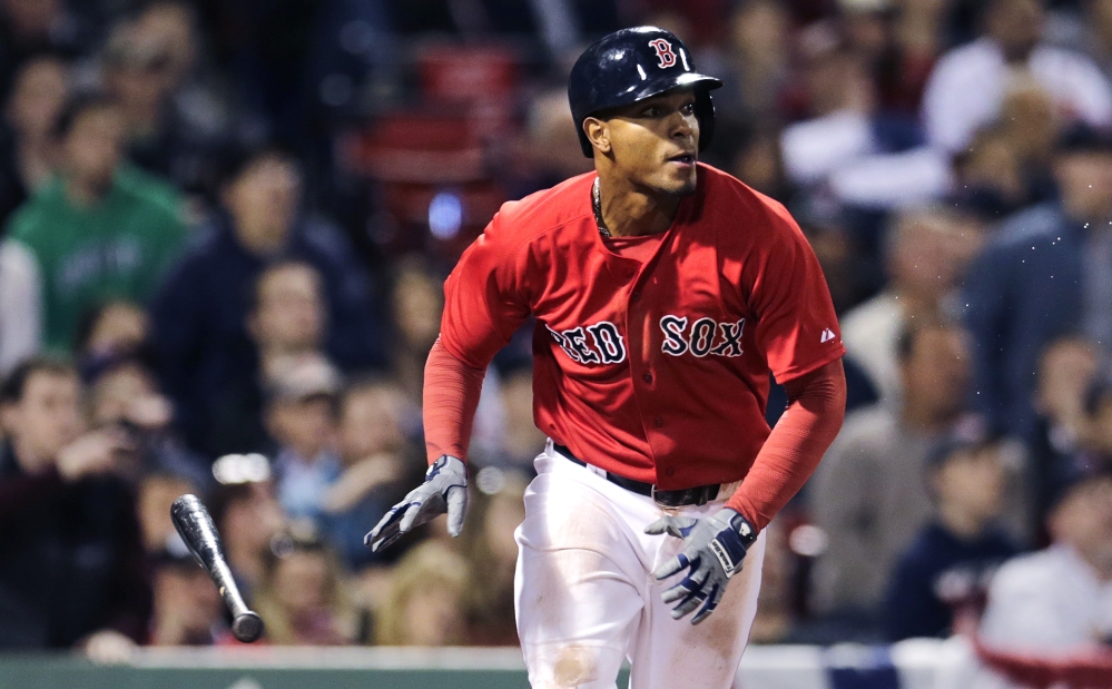 Red Sox shortstop Xander Bogaerts watches his game-winning single, which drove in teammate Mike Napoli to break a 2-2 tie with the Orioles, in the ninth inning at Fenway Park on Friday.