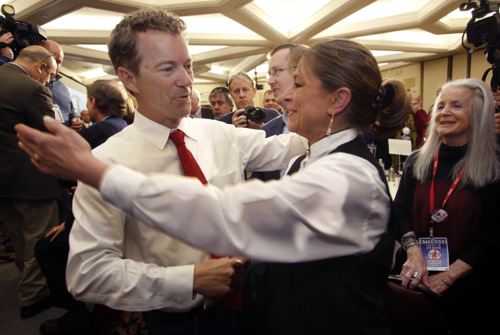 Republican presidential hopeful Sen. Rand Paul, R-Ky., gets a hug after speaking at the Republican Leadership Summit on Saturday in Nashua, N.H.