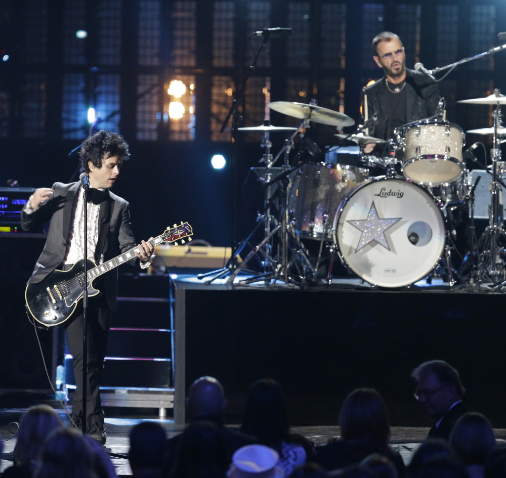 Ringo Star and Billie Joe Armstrong of Green Day perform at the Rock and Roll Hall of Fame induction ceremony Saturday night in Cleveland.