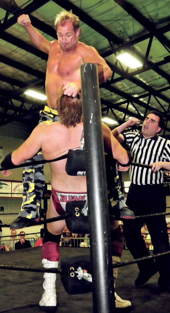 Westbrook’s Scott Garland, known professionally as Scotty 2 Hotty, winds up to land a blow against opponent Sean Burke.