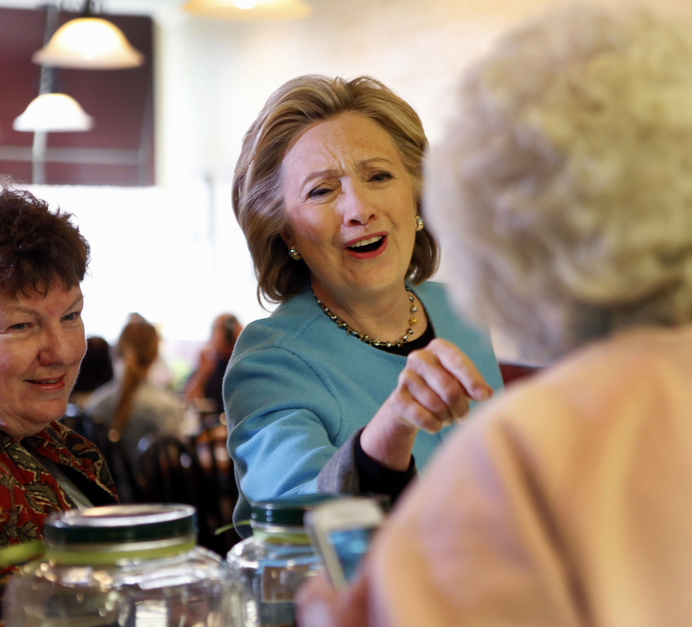 Democratic presidential candidate Hillary Rodham Clinton speaks to Doreen A. Boyea during a campaign stop  at Kristin’s Bakery on Monday in Keene, N.H.