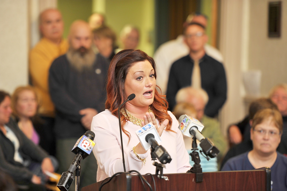 (FILE) Mellisa Luedke, seen speaking on April 21 at a public discussion of allegations of sexual abuse by two former Biddeford police officers, submitted a petition under a provision of the city charter that will compel the City Council to hold another hearing on the issue.