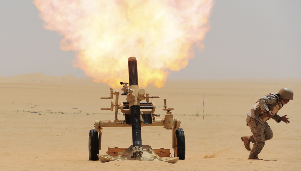 A Saudi soldier fires a mortar toward a Houthi position at the border of Saudi Arabia and Yemen on Tuesday.