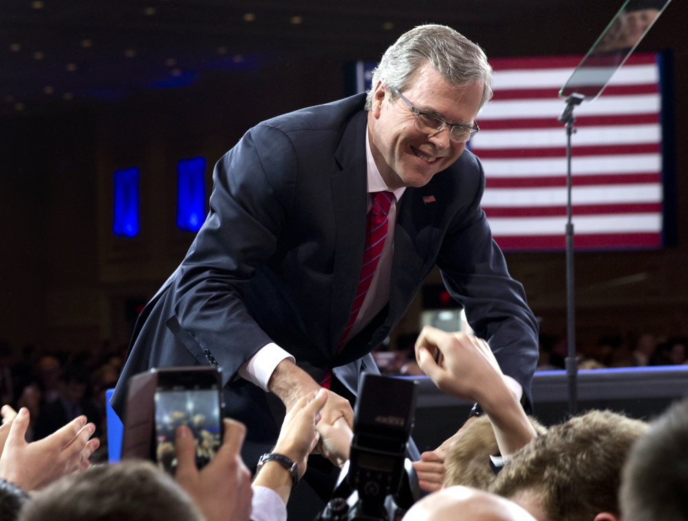 Former Florida Gov. Jeb Bush shakes hands with the audience after speaking at the Conservative Political Action Conference in National Harbor, Md., on Feb. 27. Bush has not yet announced his candidacy for president, but is raising significant sums of money.