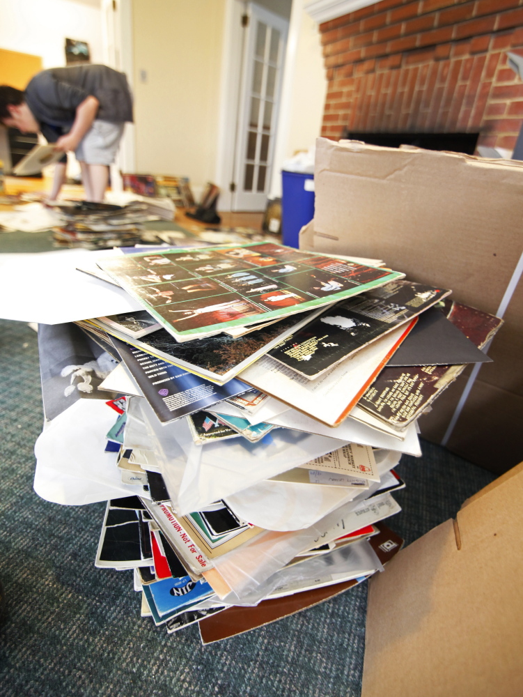 Water damaged vinyl record sleeves are stacked as WMPG scrambles to save its blues records following a flood in its studios Wednesday night, April 22, 2015 at USM in Portland. (Photo by Jill Brady/Staff Photographer)