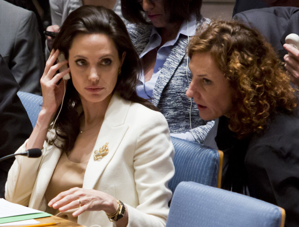 Angelina Jolie, left, appears at the United Nations on Friday to draw attention to the world’s inaction on Syria’s 4-year-old war.