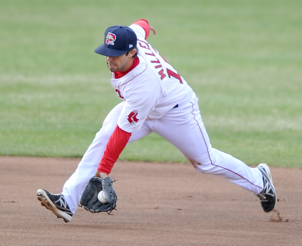 Portland shortstop Mike Miller snags a hard grounder before making the throw for an out Friday night at Hadlock Field. Gordon Chibroski/Staff Photographer