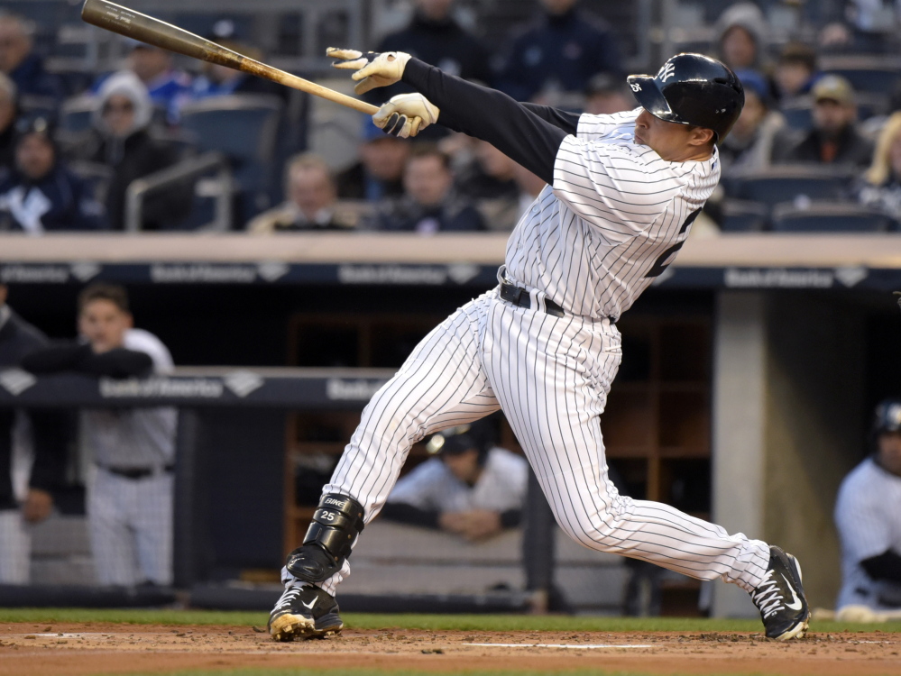 Mark Teixeira hits a two-run home run during the Yankees’ 6-1 win over the Mets Friday at Yankee Stadium.