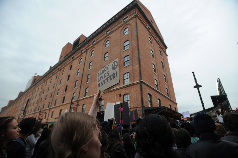 Protestors rally at Oriole Park at Camden Yards during a march for Freddie Gray, Saturda