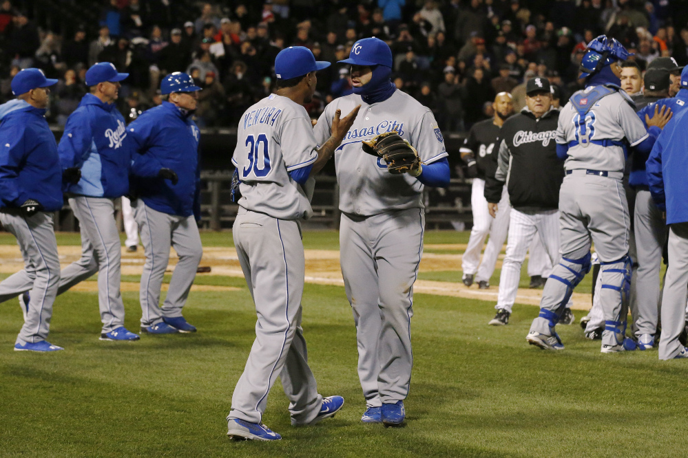 Kansas City Royals starting pitcher Yordano Ventura is pulled aside by teammate Mike Moustakas as the benches clear during the seventh inning against the Chicago White Sox on Thursday.