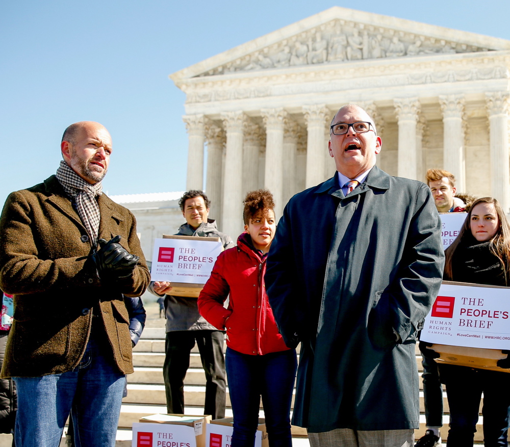 The named plaintiff in Obergefell v. Hodges, Jim Obergefell, right, appears at a Human Rights Campaign rally on March 6. As Obergefell explains, he and partner John Arthur were watching TV in 2013 when the Supreme Court struck down part of the Defense of Marriage Act. “I just leaned over, hugged and kissed John, and said, ‘Let’s get married,’ ” he recalls.