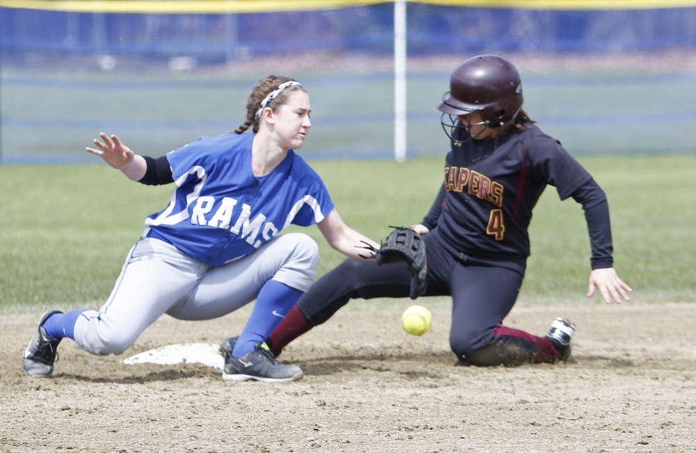 Michaela Pinette of Cape Elizabeth slides safely into second as Kennebunk’s Malori Cole tries to field the throw. Pinette’s two-run single in the third inning started the Capers’ comeback after they fell behind 4-0.