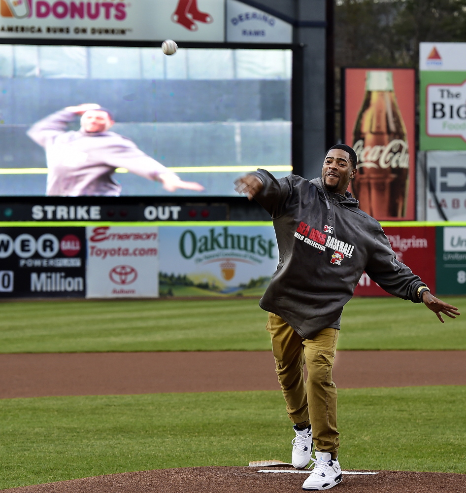 New England Patriot Malcolm Butler throws out the ceremonial first pitch before the start of Monday's game as Portland Sea Dogs hosted the Binghamton Mets in AA baseball action at Hadlock Field. (Photo by Gordon/ Staff Photographer)