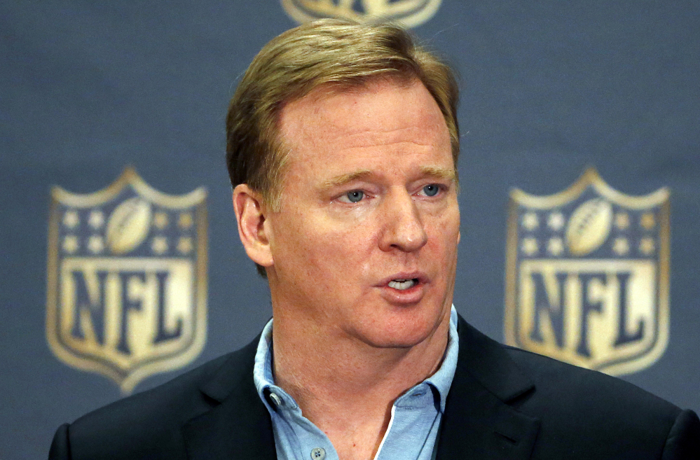 In this March 25, 2015, file photo, NFL Commissioner Roger Goodell addresses the media at a news conference at the NFL Annual Meeting in Phoenix.