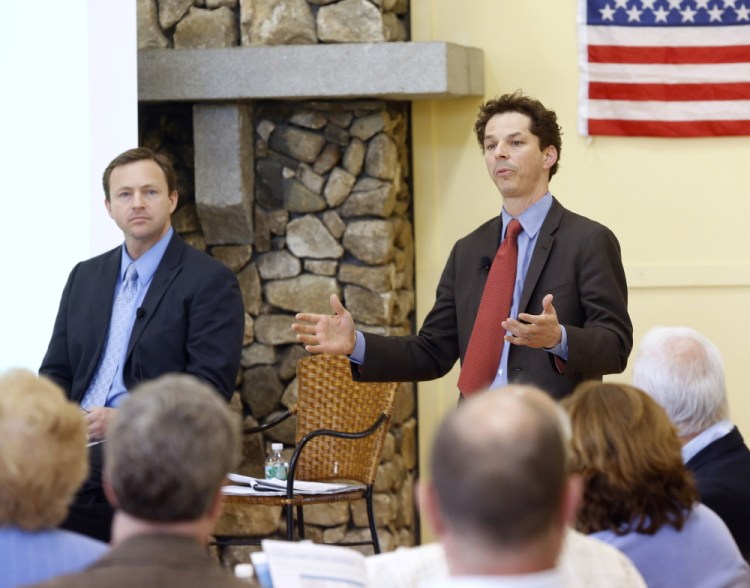 Sen. Justin Alfond, D-Portland, speaks as Democratic leaders hold a town hall meeting Tuesday night in Scarborough to discuss their plan to counter Gov. Paul LePage's proposed tax overhaul. House Speaker Mark Eves, D-North Berwick, left, listens as Alfond speaks. 
Derek Davis/Staff Photographer
