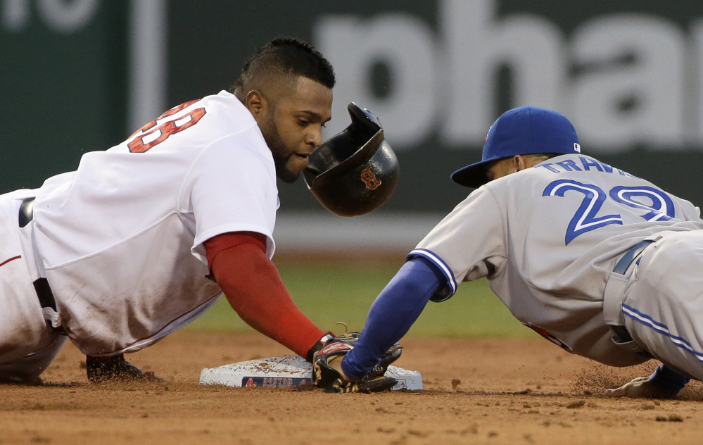 Boston's Pablo Sandoval loses his helmet as he arrives safely at second base as Toronto's Devon Travis tries to make the tag. (AP Photo/Steven Senne)