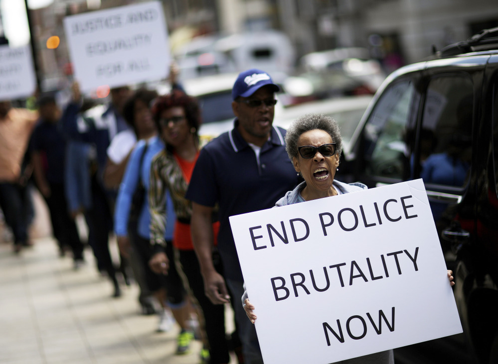 Protesters demonstrate outside the state attorney’s office Wednesday calling for the continued investigation into the death of Freddie Gray. Activists stressed that they will continue to press for answers in the case.