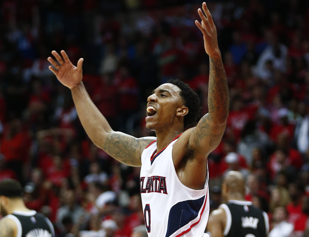 Jeff Teague of the Atlanta Hawks celebrates Wednesday night after a 107-97 victory against the Brooklyn Nets that gave Atlanta a 3-2 lead in their first-round series.