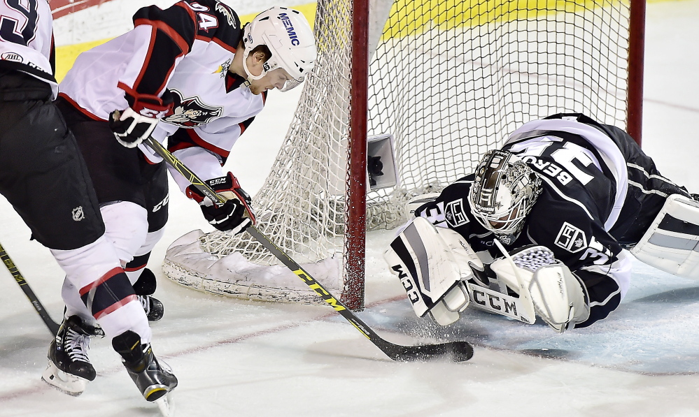 Pirate Brendan Shinnimin tries several times to put the puck in the goal but is stopped by Monarchs goalie Jean-Francois Berube in Game 4 of their AHL playoff series Thursday. The Pirates shut out the Monarchs at the Cross Insurance Arena.