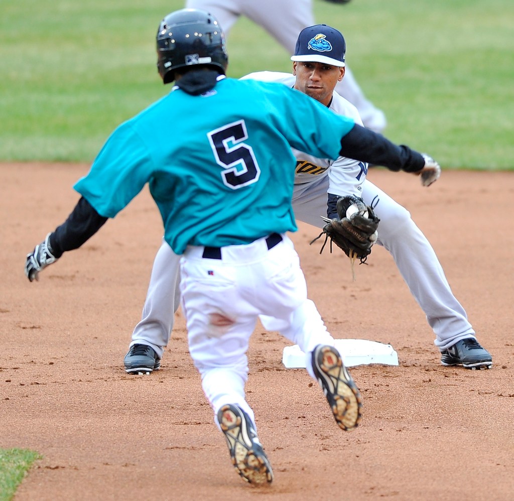 Sea Dogs second baseman Carlos Asuaje attempts a steal against the Trenton Thunder at Hadlock Field on Thursday. Gordon Chibroski/ Staff Photographer