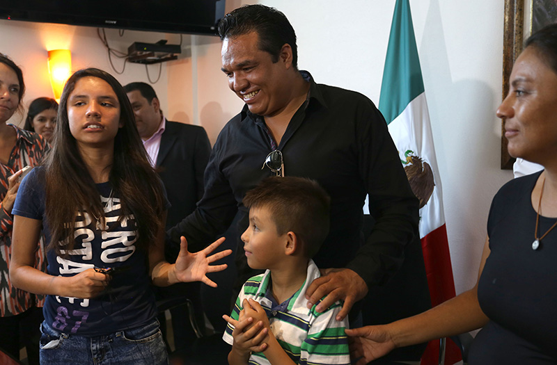 Alondra Luna Nunez, left,  with her parents Gustavo Luna and Susana Nunez  in Silao, Mexico.