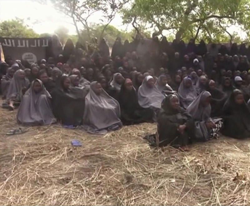 Image taken from a 2014 video by Nigeria's Boko Haram terrorist network, shows the alleged missing girls abducted from the northeastern town of Chibok.