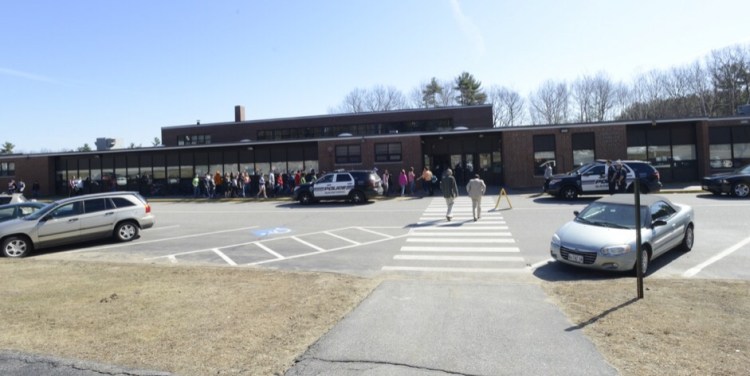 Students and staff return to Sanford Junior High School after a bomb threat on Thursday morning.