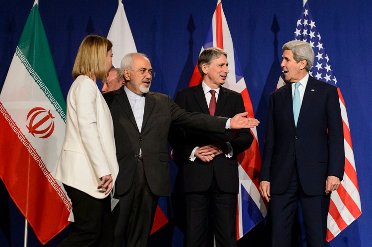 From left, EU High Representative for Foreign Affairs and Security Policy, Federica Mogherini, Iranian Foreign Minister, Mohammad Javad Zarif, British Foreign Secretary, Philip Hammond, and U.S. Secretary of State, John Kerry, line up for a press announcement after the end of a new round of nuclear Iran talks in in Lausanne, Switzerland, Thursday. The Associated Press