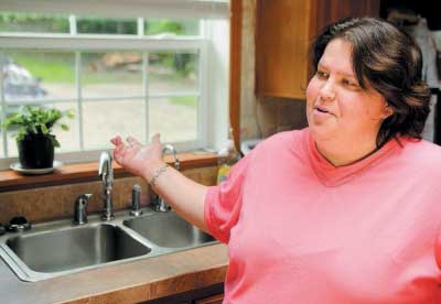 Wendy Brennan had an $800 reverse osmosis filtration system installed in her Mount Vernon home when she found out that her family’s drinking water contained high levels of arsenic – but not everybody can afford remediation on problem wells. 2011 Kennebec Journal File Photo/Joe Phelan