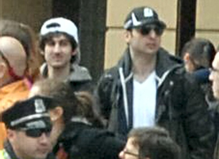 Dzhokhar, left, and Tamerlan Tsarnaev are shown at the Boston Marathon in 2013. Dzhokhar's defense lawyers argue that Tamerlan was the driving force behind the attacks.