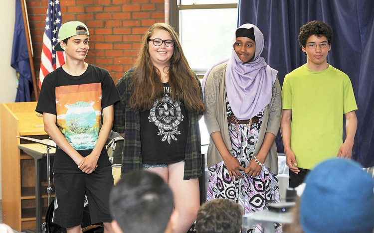 Julien Peck, left, Naomi Radtke Rowe, both freshmen; Ayan Amed, a junior; and Nate Robinson, a sophomore, were picked by the Casco Bay High School to spend a couple of weeks on two tall ships as they sail toward Portland for a tall ship festival in July.  