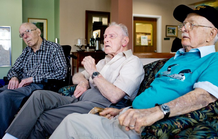 From left, Larry Wright, 88, George Watson, 92, and Robert Kimball, 90, all World War II veterans who live at Gorham House, gather at the home Thursday, a day before leaving for Washington as part of Maine's Honor Flight program.