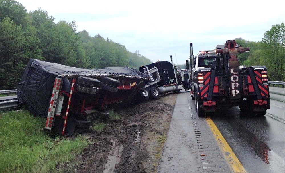 No injuries resulted from a storm-related collision between a car and a tractor-trailer truck late Thursday afternoon in the southbound lane of Interstate 295 in Falmouth, but traffic was snarled for miles in both directions.