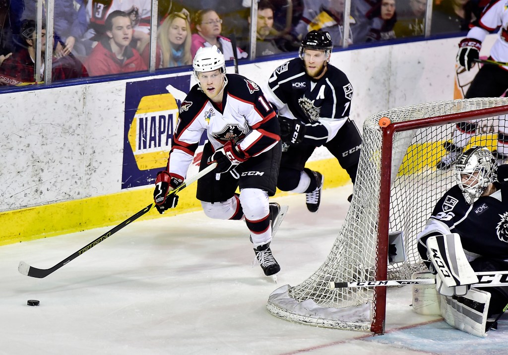 Francis Wathier, chased by Andrew Bodnarchuk of Manchester, has received more ice time for the Portland Pirates in the playoffs and taken advantage, including two goals Thursday night in a 5-0 victory. Gordon Chibroski/Staff Photographer