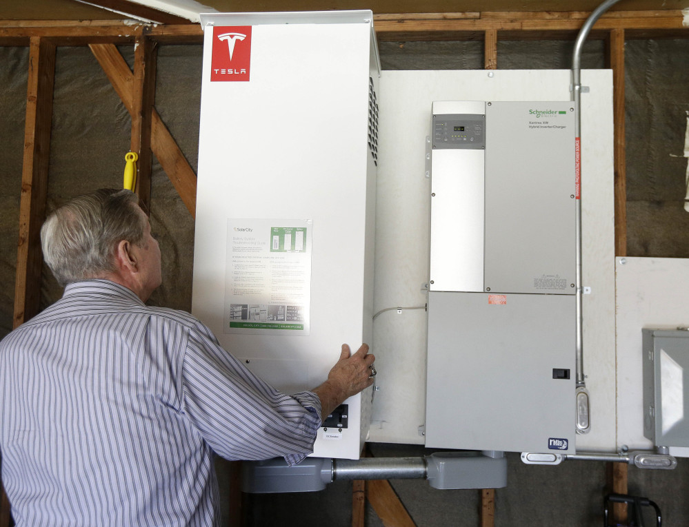 A prototype Tesla battery system powers the Foster City, Calif., home of David Cunningham , who installed the battery late last year to pair with his solar panels as part of a pilot program run by the California Public Utilities Commission.
