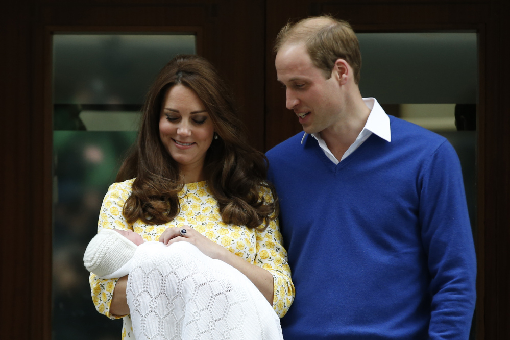 Britain’s Prince William, right, and Kate, Duchess of Cambridge, with their newborn daughter pose for the media outside St. Mary’s Hospital’s exclusive Lindo Wing, London, on May 2. 